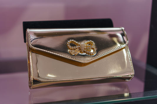 'Stella' Bow Clutch bag in Gold